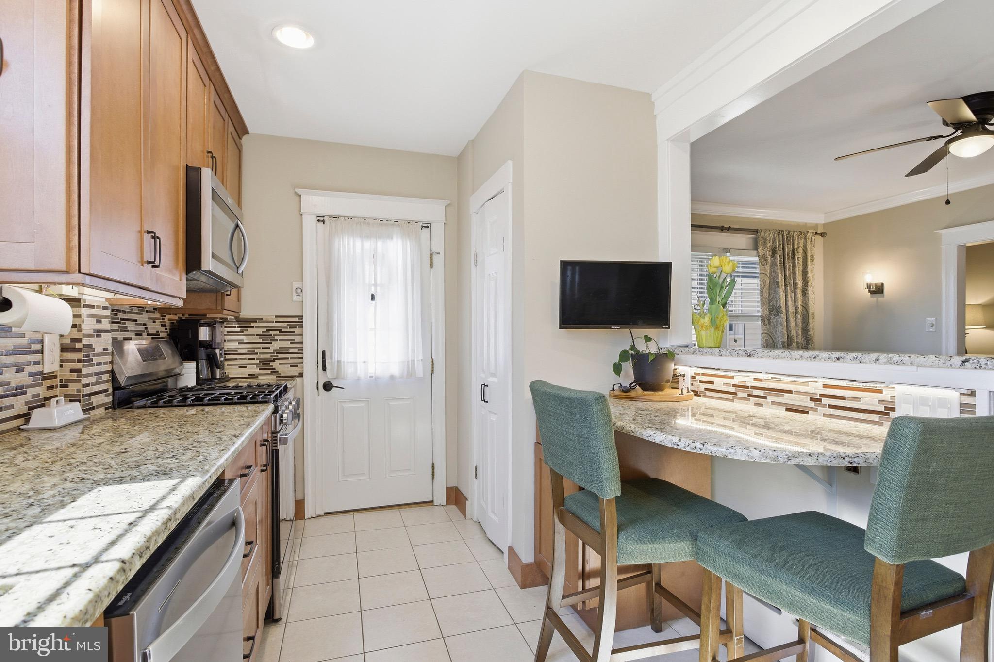 277 Ballymore Road Springfield, PA 19064 - Photo 11 of 34 a large kitchen with a stove and a sink