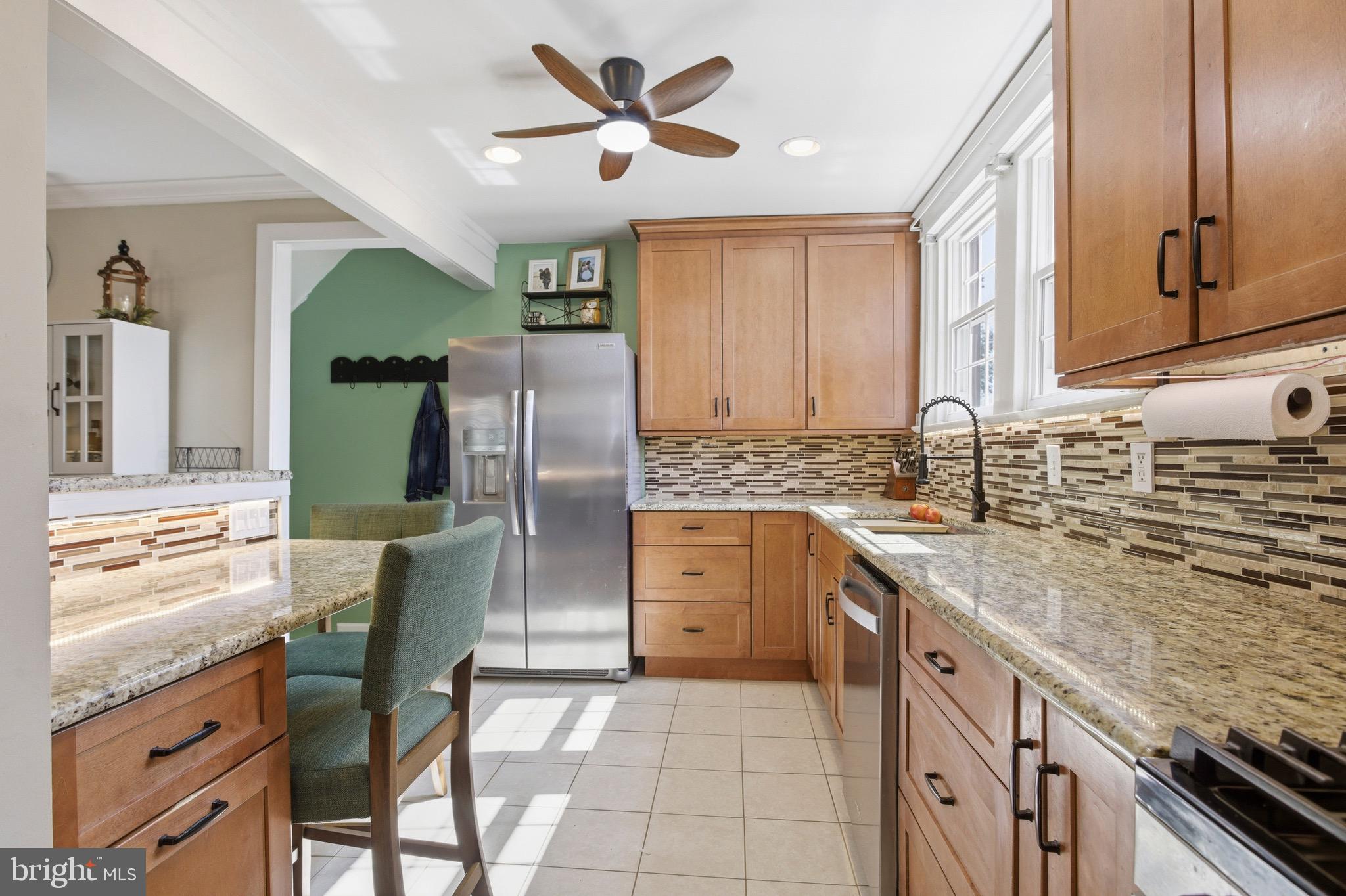277 Ballymore Road Springfield, PA 19064 - Photo 12 of 34 a kitchen with granite countertop a sink stainless steel appliances and cabinets
