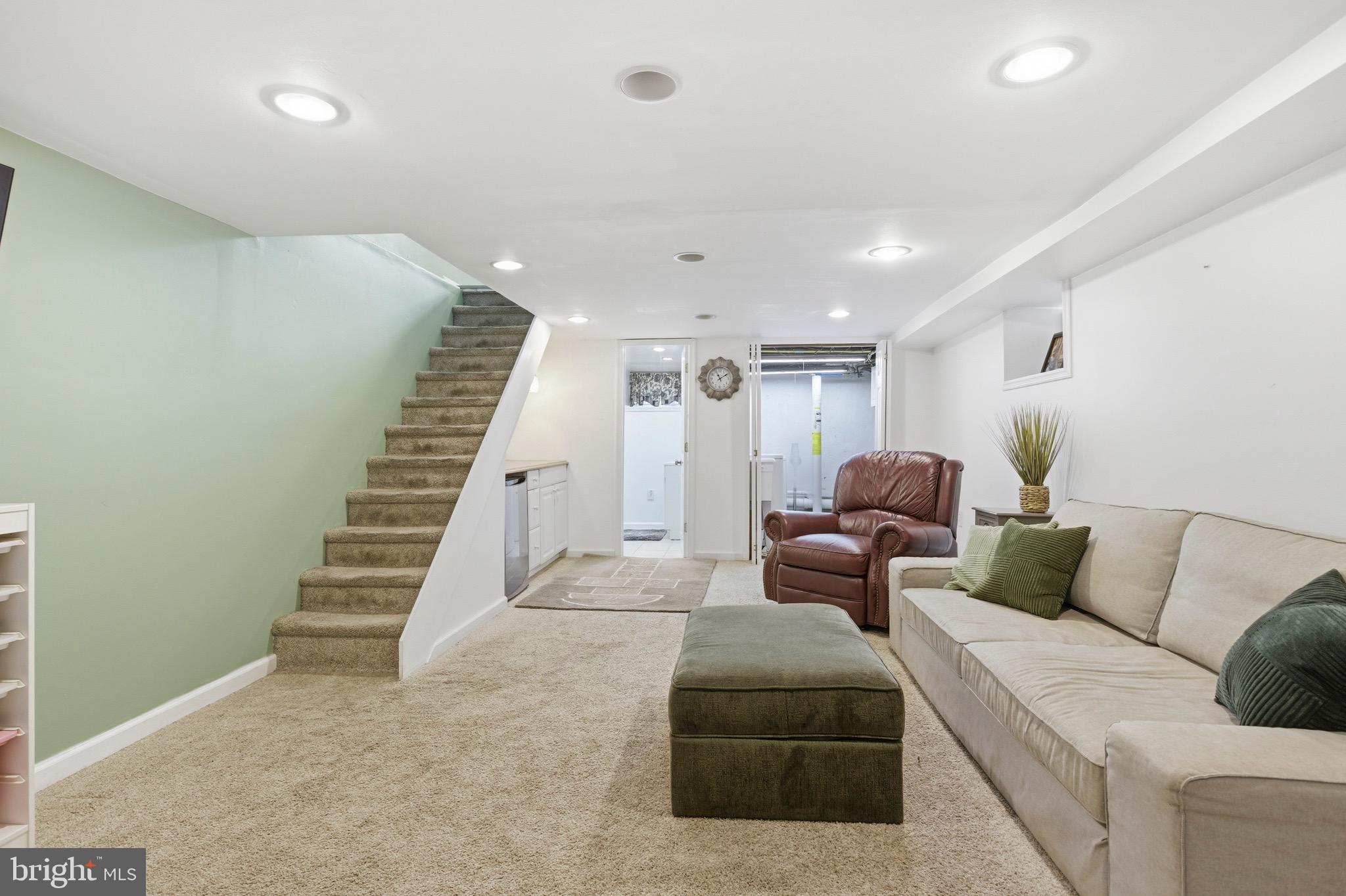 277 Ballymore Road Springfield, PA 19064 - Photo 24 of 34 a living room with furniture and stairs