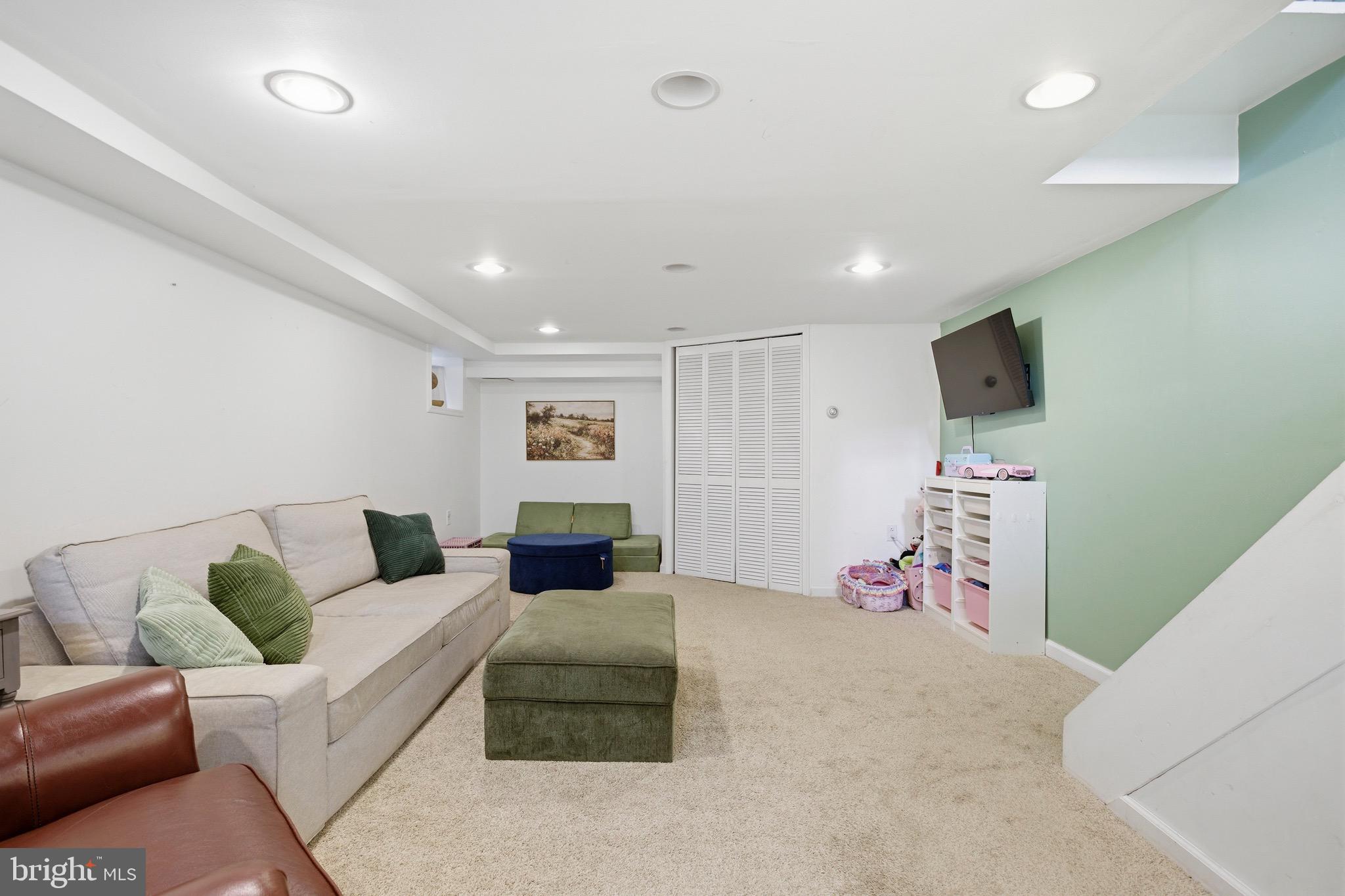 277 Ballymore Road Springfield, PA 19064 - Photo 25 of 34 a living room with furniture and a flat screen tv