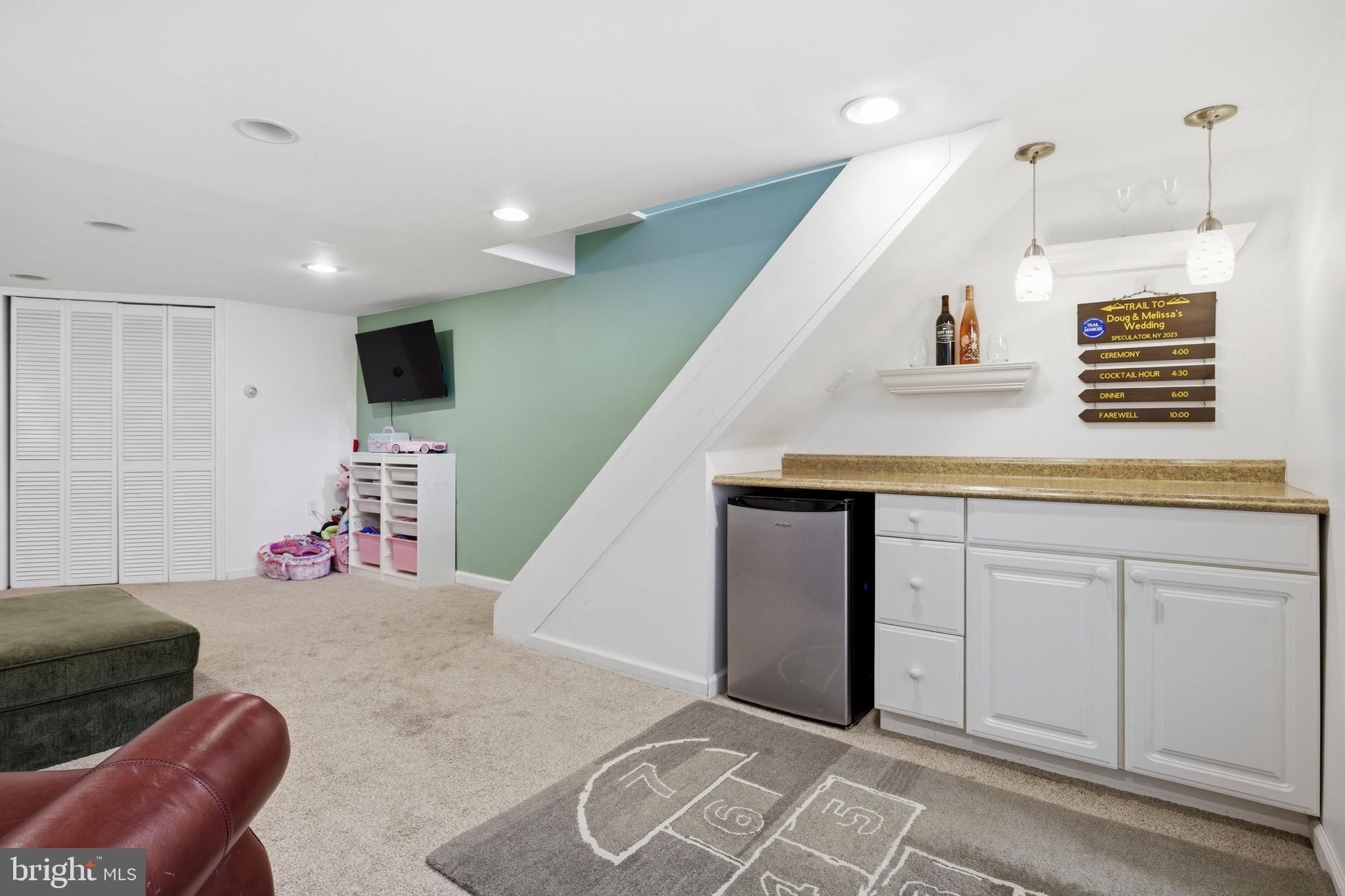 277 Ballymore Road Springfield, PA 19064 - Photo 26 of 34 a living room with furniture and a flat screen tv