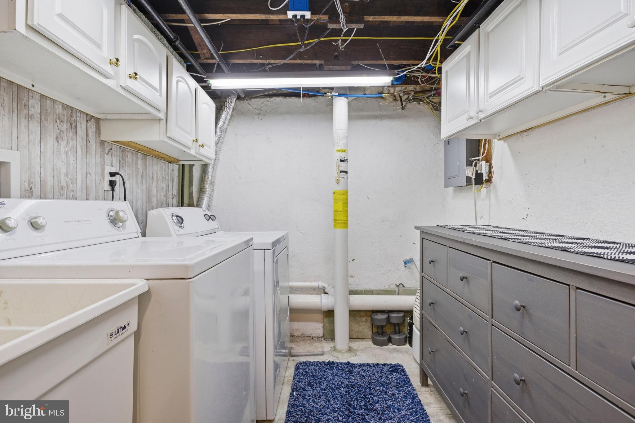 277 Ballymore Road Springfield, PA 19064 - Photo 28 of 34 a utility room with a sink a washer and dryer