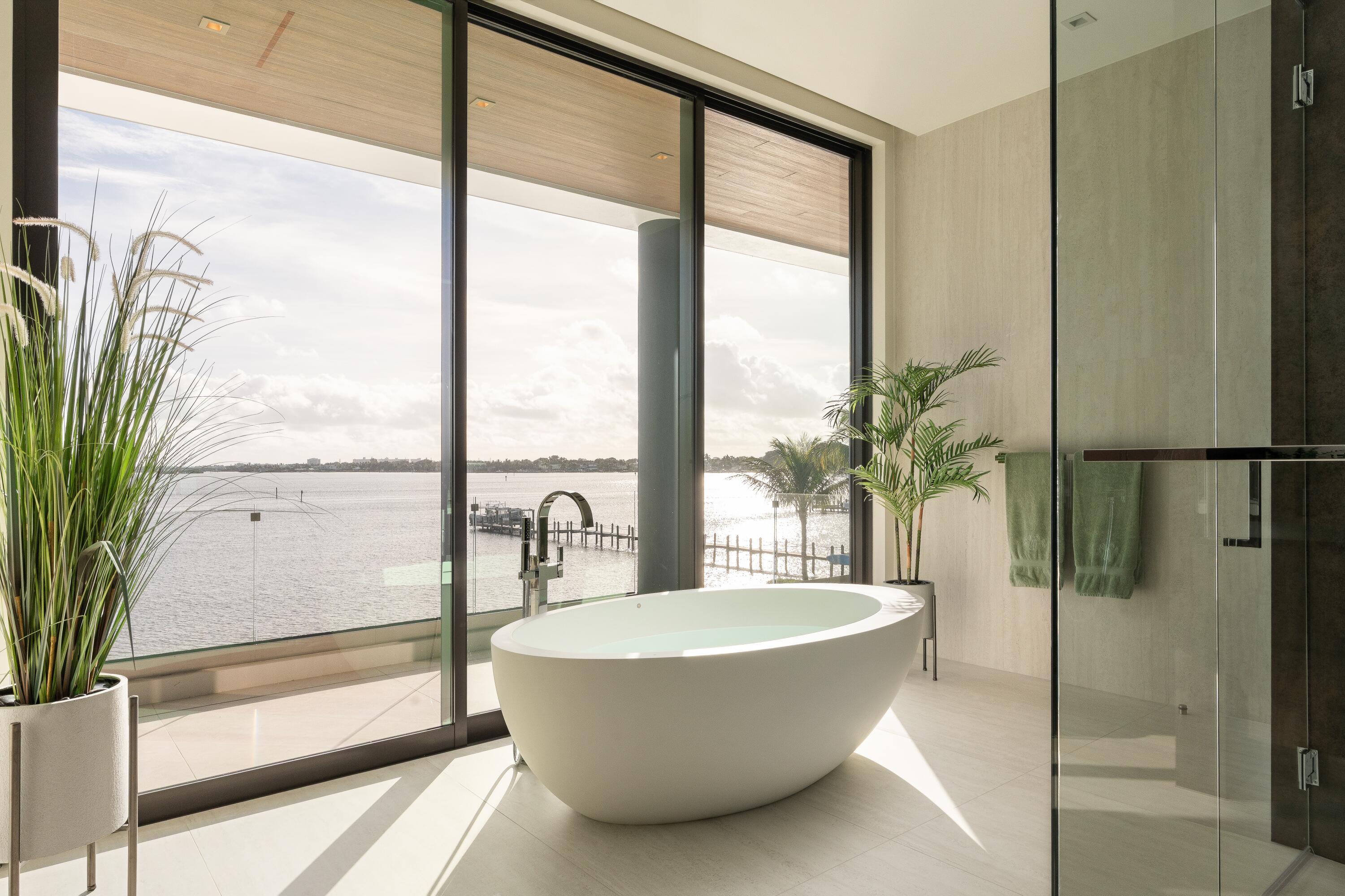 5211 Pennock Point Road Jupiter, FL 33458 - Photo 40 of 69 a view of a bathtub & door in a bathroom