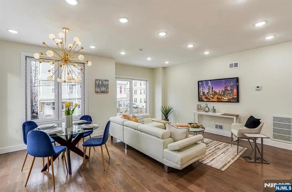 210 22nd Street, Unit 1 Irvington, NJ 07111 - Photo 6 of 22 a living room with furniture and a large window