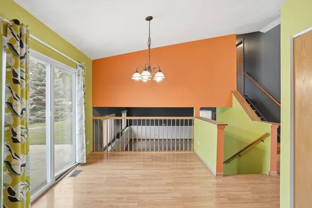 a view of a balcony with wooden floor