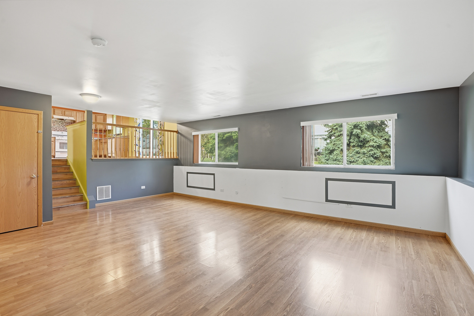 1986 Brimstone Road Romeoville, IL 60446 - Photo 12 of 32 a view of an empty room with a window and wooden floor