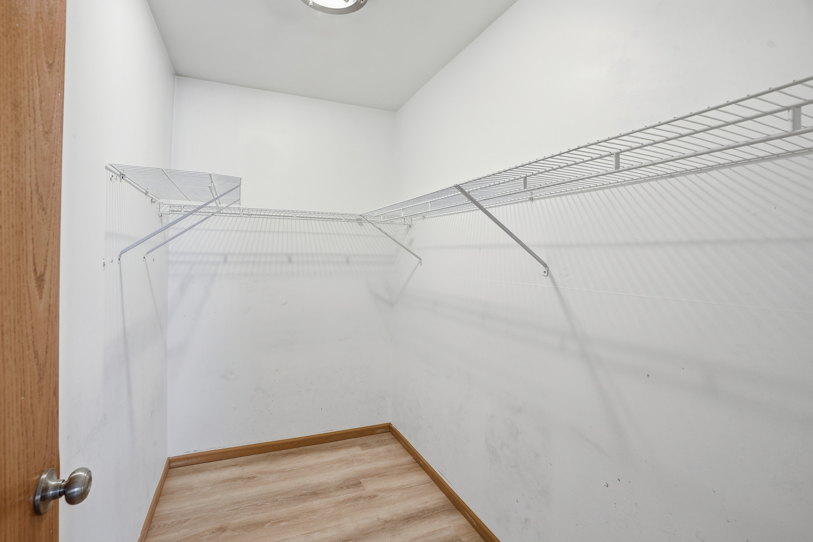 1986 Brimstone Road Romeoville, IL 60446 - Photo 17 of 32 a view of a room with racks on the wall