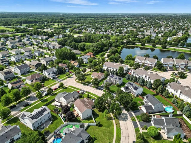 an aerial view of residential houses with outdoor space
