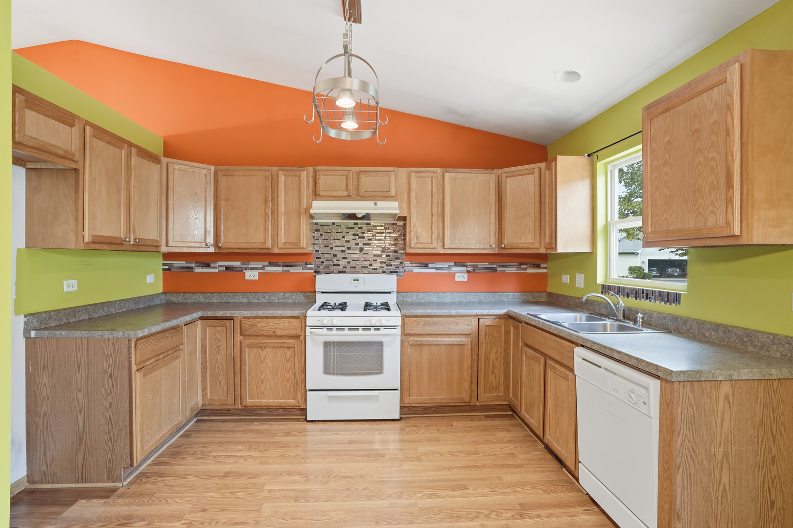 1986 Brimstone Road Romeoville, IL 60446 - Photo 5 of 32 a kitchen with stainless steel appliances granite countertop a sink a stove and cabinets