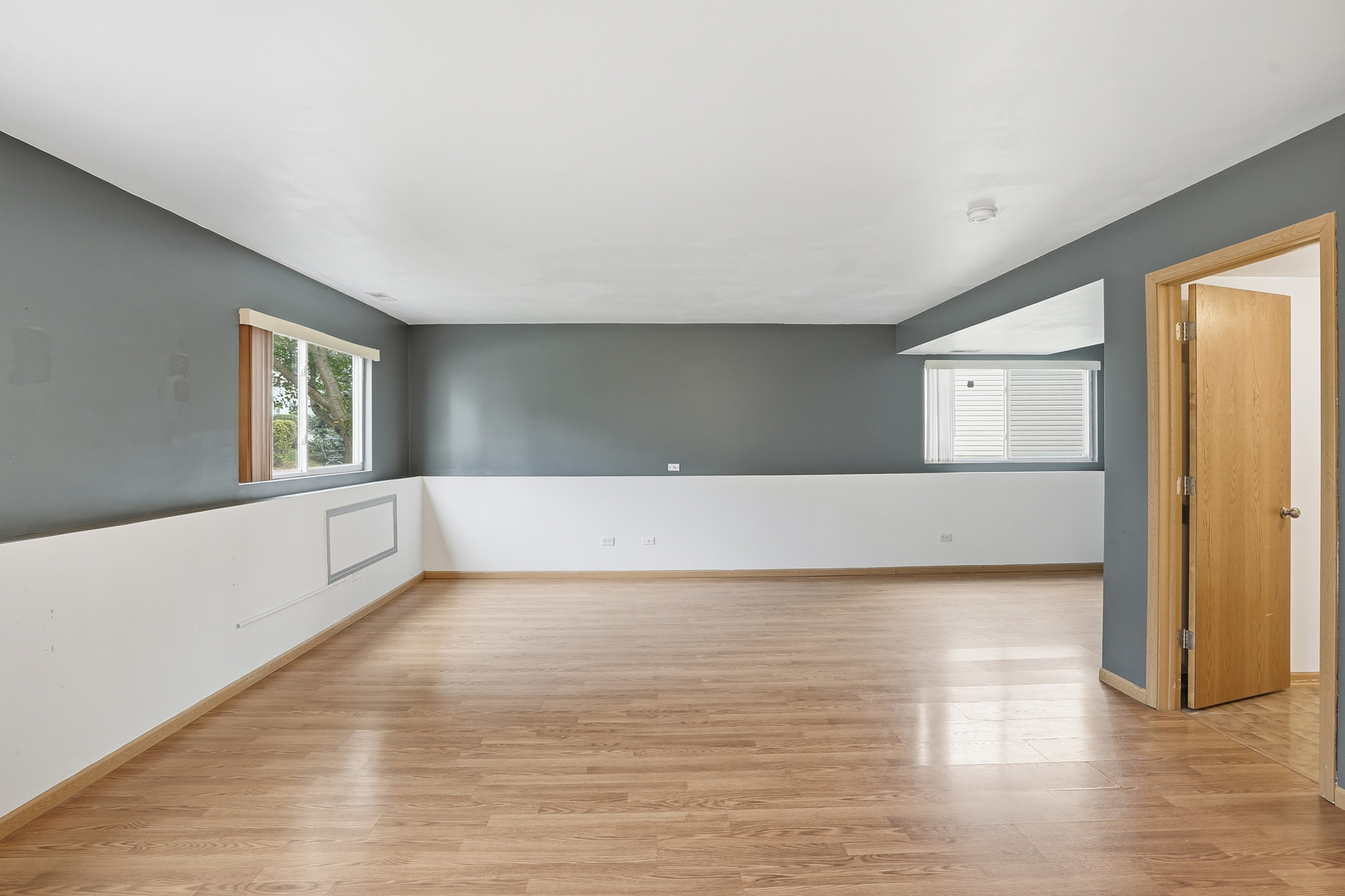 1986 Brimstone Road Romeoville, IL 60446 - Photo 10 of 32 a view of a big room with wooden floor and windows