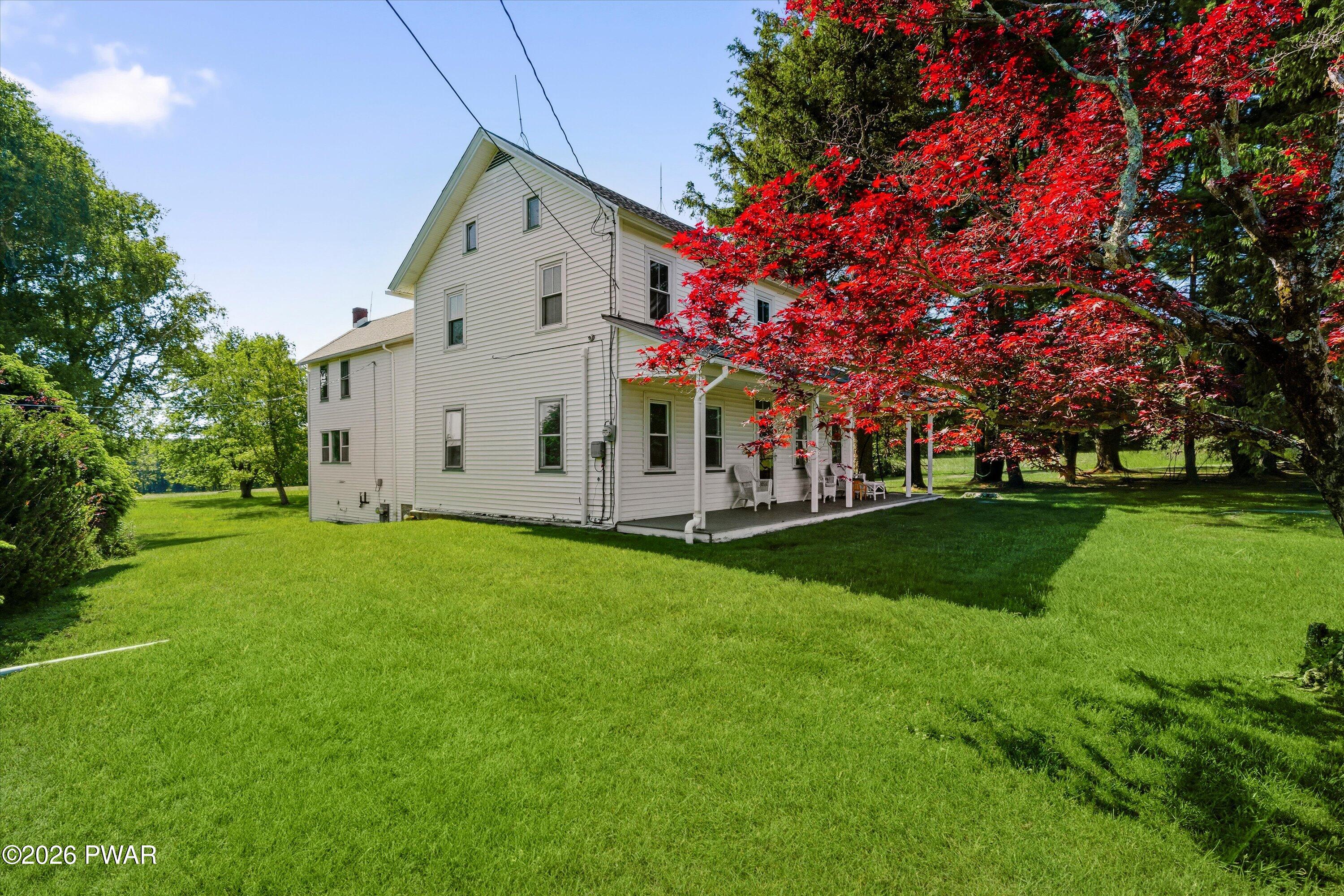 127 Valleyview Road Greentown, PA 18426 - Photo 58 of 66 a front view of a house with garden