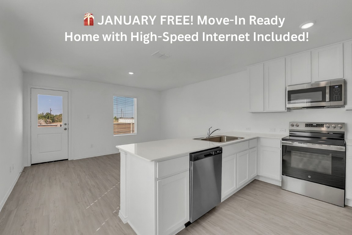 a kitchen with granite countertop a sink and a stove top oven