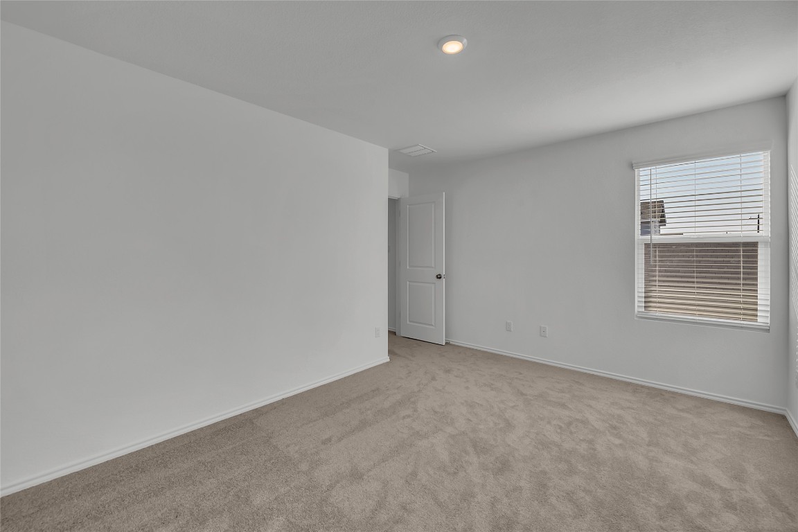 309 Marty Allen Loop Jarrell, TX 76537 - Photo 12 of 30 a view of an empty room with a window