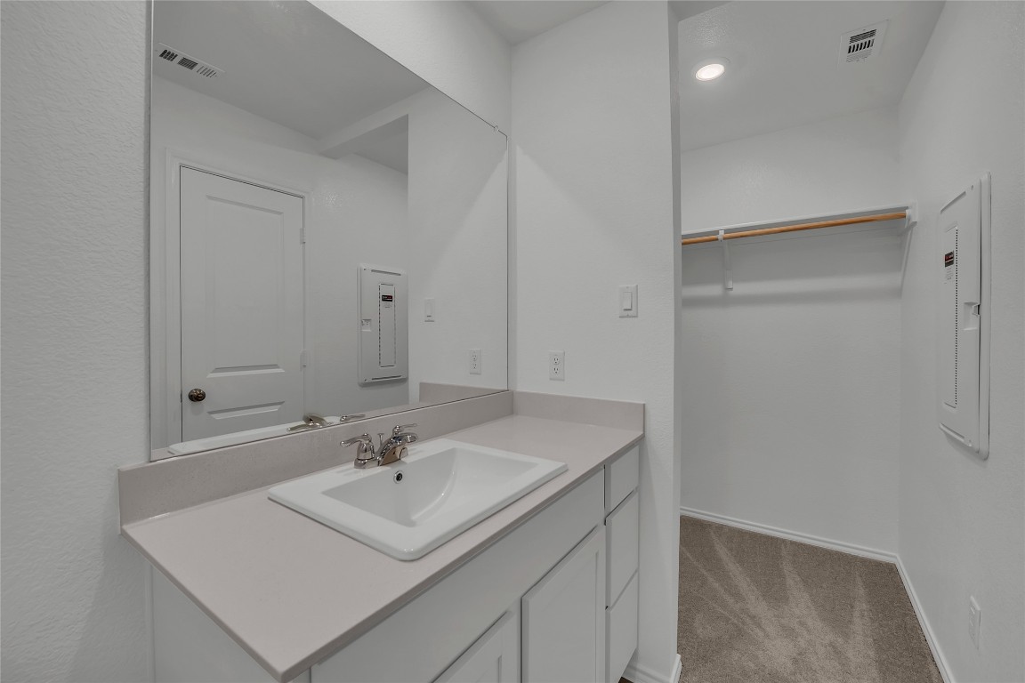 309 Marty Allen Loop Jarrell, TX 76537 - Photo 15 of 30 a bathroom with a sink vanity and a mirror