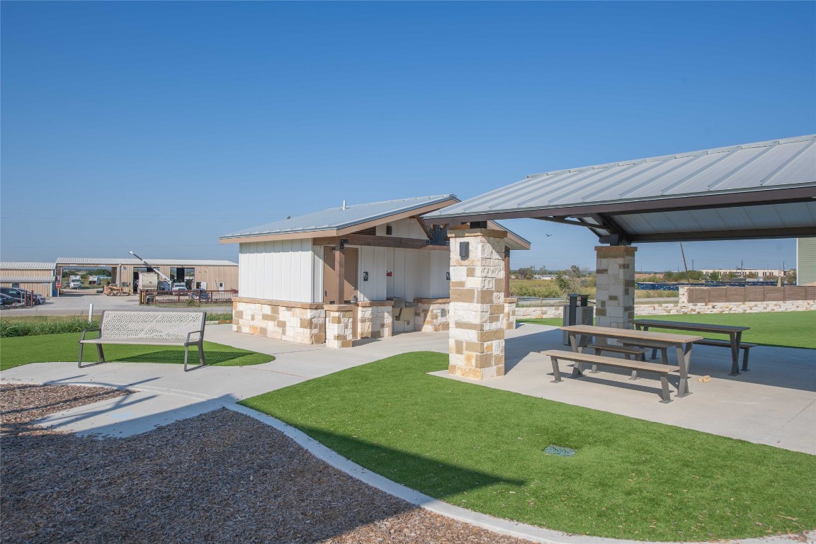 309 Marty Allen Loop Jarrell, TX 76537 - Photo 20 of 30 a swimming pool with outdoor seating and yard