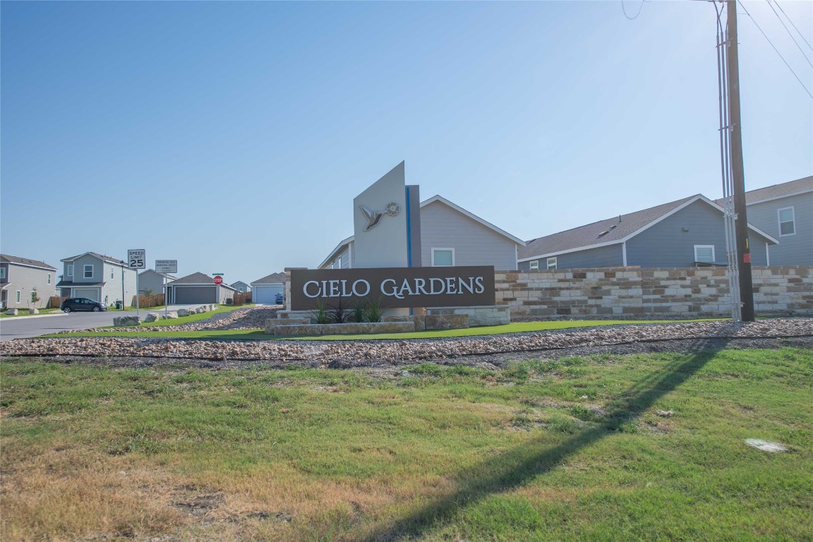 309 Marty Allen Loop Jarrell, TX 76537 - Photo 27 of 30 a view of a house with a yard and table and chair