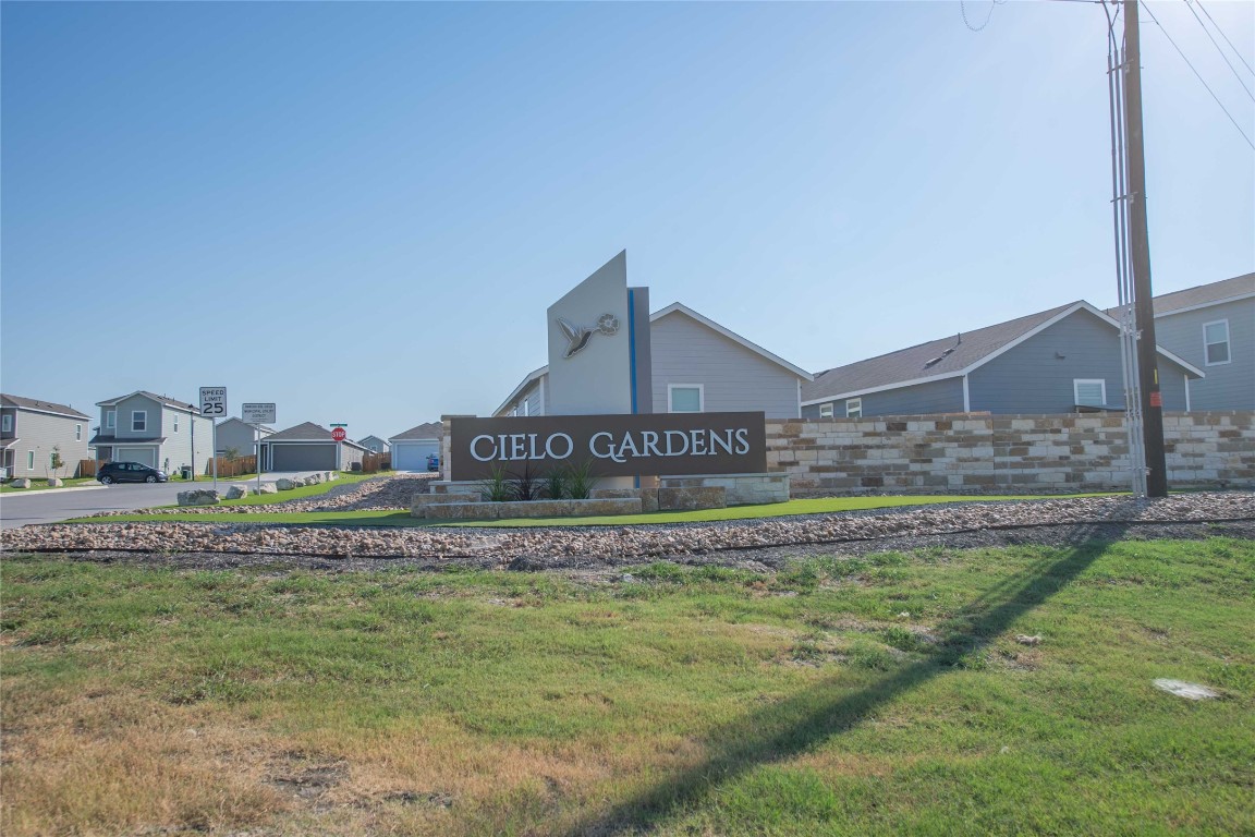 309 Marty Allen Loop Jarrell, TX 76537 - Photo 28 of 30 Community / neighborhood sign with a lawn and a residential view