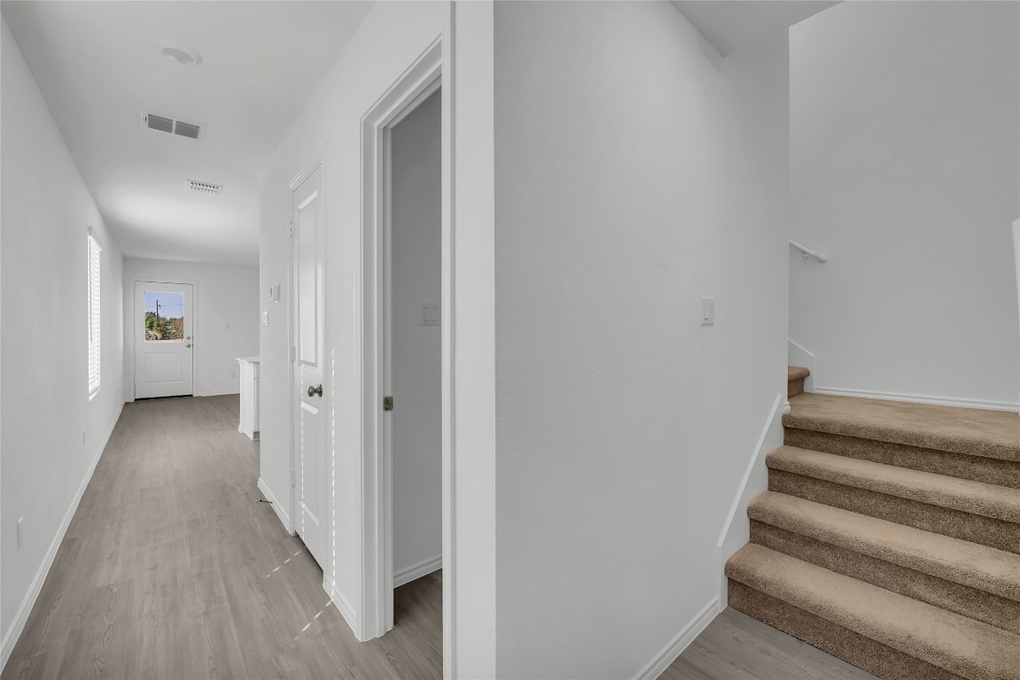 309 Marty Allen Loop Jarrell, TX 76537 - Photo 5 of 30 a view of a hallway with wooden floor and entryway
