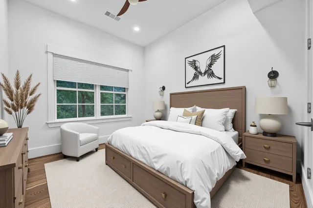 a spacious bathroom with a tub sink and mirror