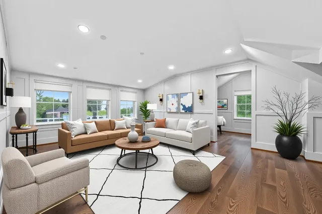 an empty room with wooden floor and window