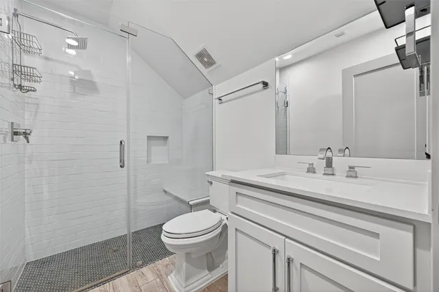 a view of a balcony with wooden floor and fence