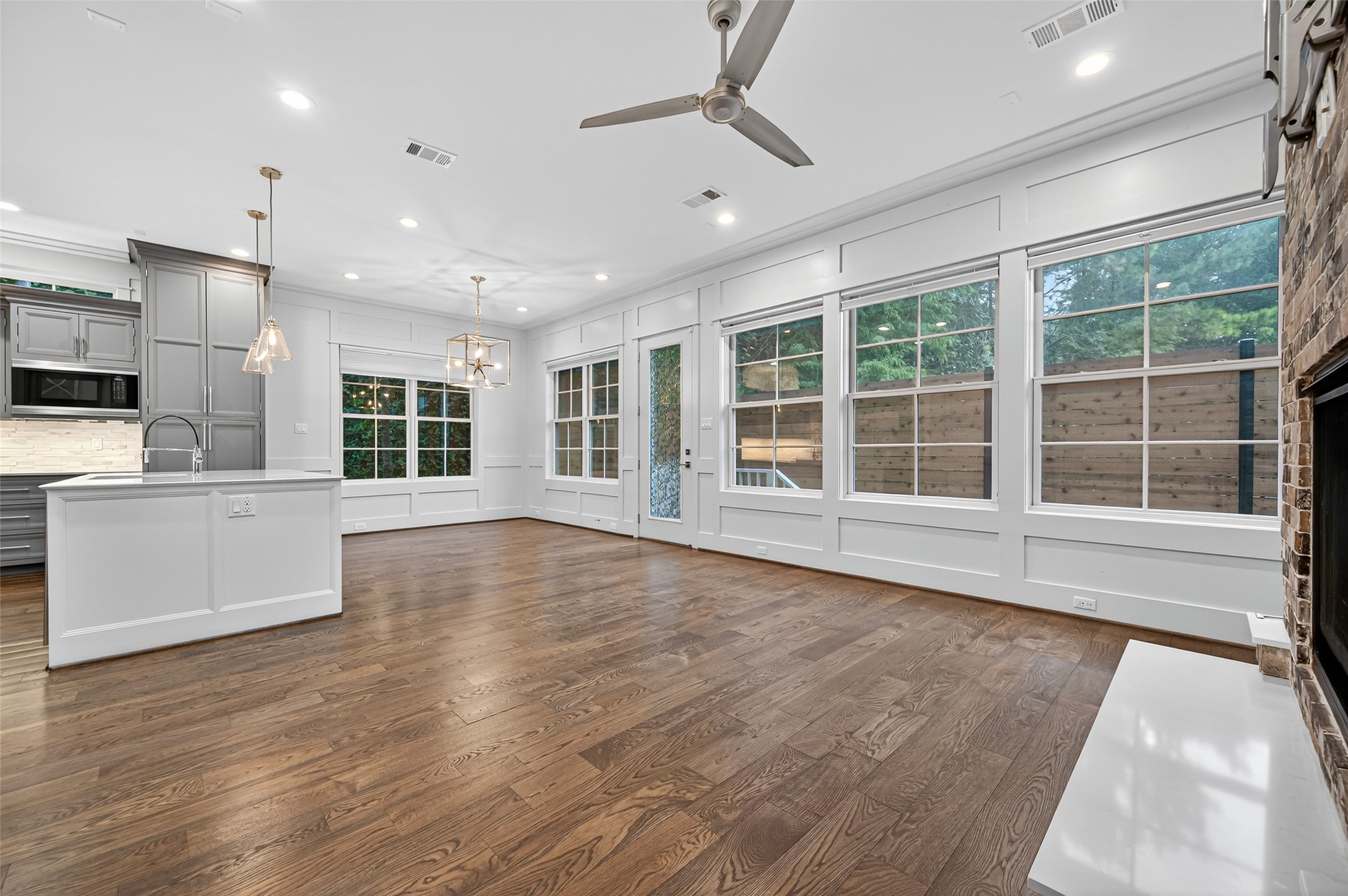 428 Marshall Street Houston, TX 77006 - Photo 6 of 36 a view of an empty room with a window and wooden floor
