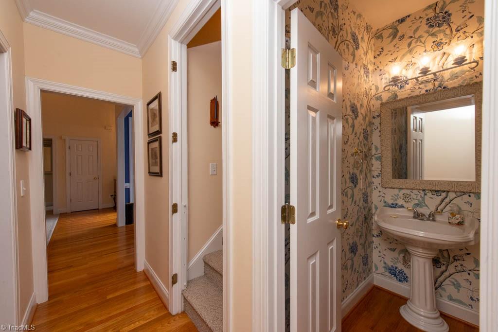 3859 Waterview Road High Point, NC 27265 - Photo 25 of 38 Guest 1/2 bathroom. Door to bonus room in walk in attic.