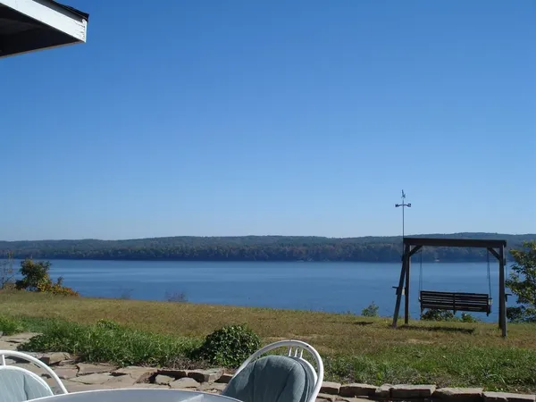 a view of a balcony with an outdoor space and lakeside