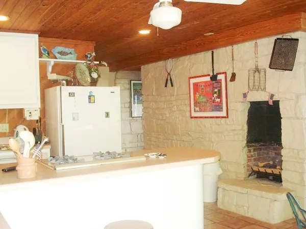 a bathroom with a sink mirror and vanity