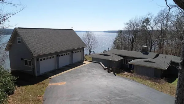 a backyard of a house with outdoor seating