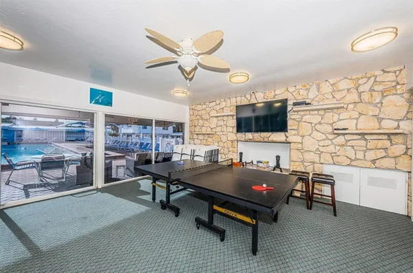 a living room with a table and chairs