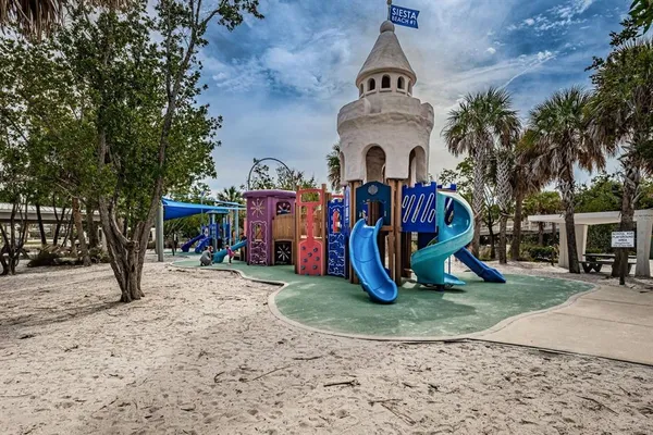a view of a park with swings and slides