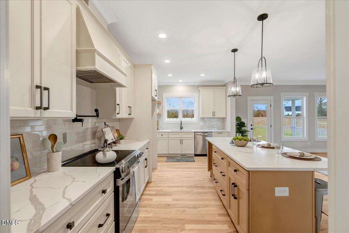 2280 Heartland Road Battleboro, NC 27809 - Photo 13 of 46 a kitchen with kitchen island granite countertop lots of counter top space