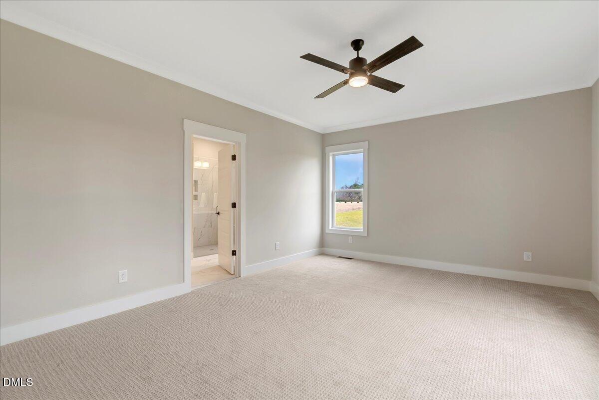 2280 Heartland Road Battleboro, NC 27809 - Photo 21 of 46 a view of a livingroom with a ceiling fan & windows