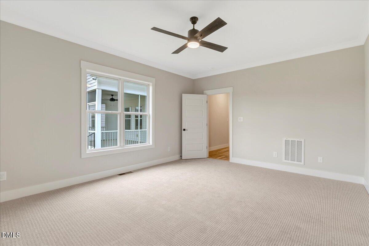 2280 Heartland Road Battleboro, NC 27809 - Photo 22 of 46 an empty room with ceiling fan and windows