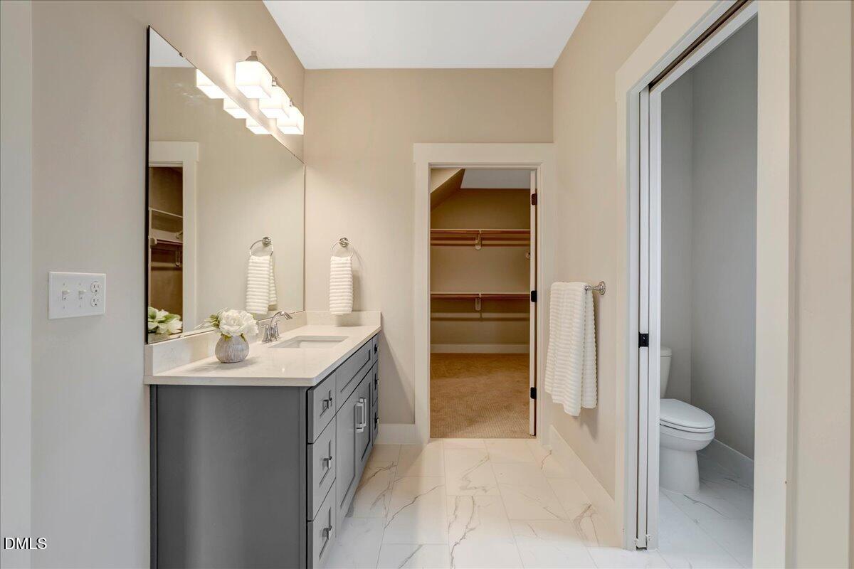 2280 Heartland Road Battleboro, NC 27809 - Photo 23 of 46 a en suite bathroom with a sink toilet and shower
