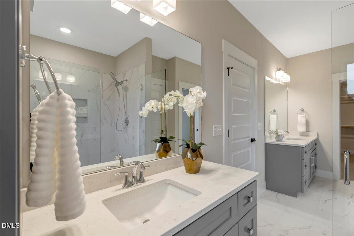 2280 Heartland Road Battleboro, NC 27809 - Photo 30 of 46 a bathroom with a sink and a mirror