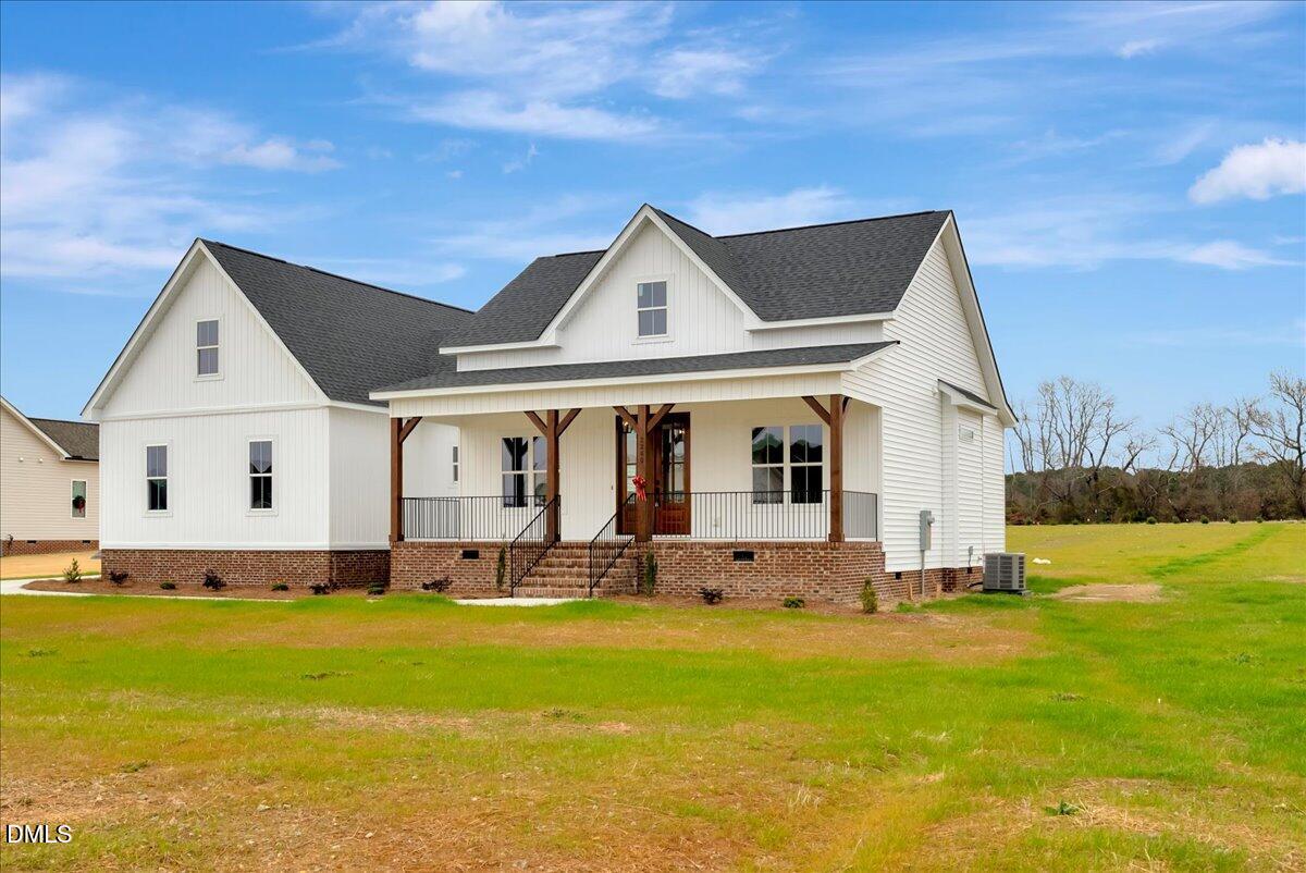 2280 Heartland Road Battleboro, NC 27809 - Photo 40 of 46 a front view of house with yard outdoor seating and barbeque oven