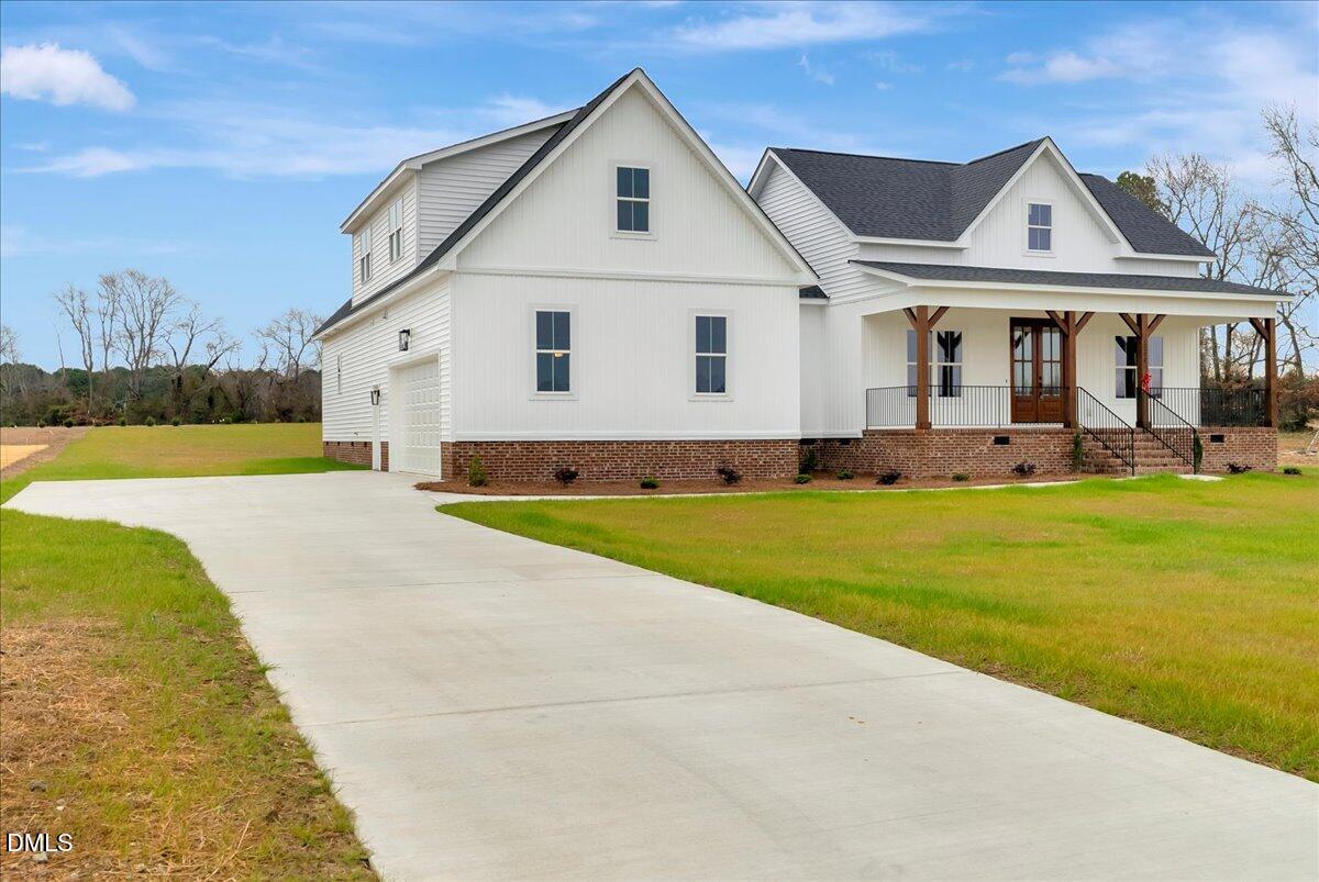 2280 Heartland Road Battleboro, NC 27809 - Photo 41 of 46 a front view of a house with a yard