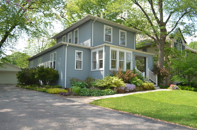 546 North County Line Road Hinsdale, IL 60521 - Photo 1 of 12 a front view of house with yard and green space