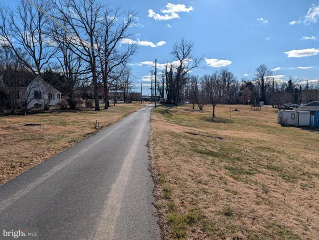 a view of a yard with a snow on the road
