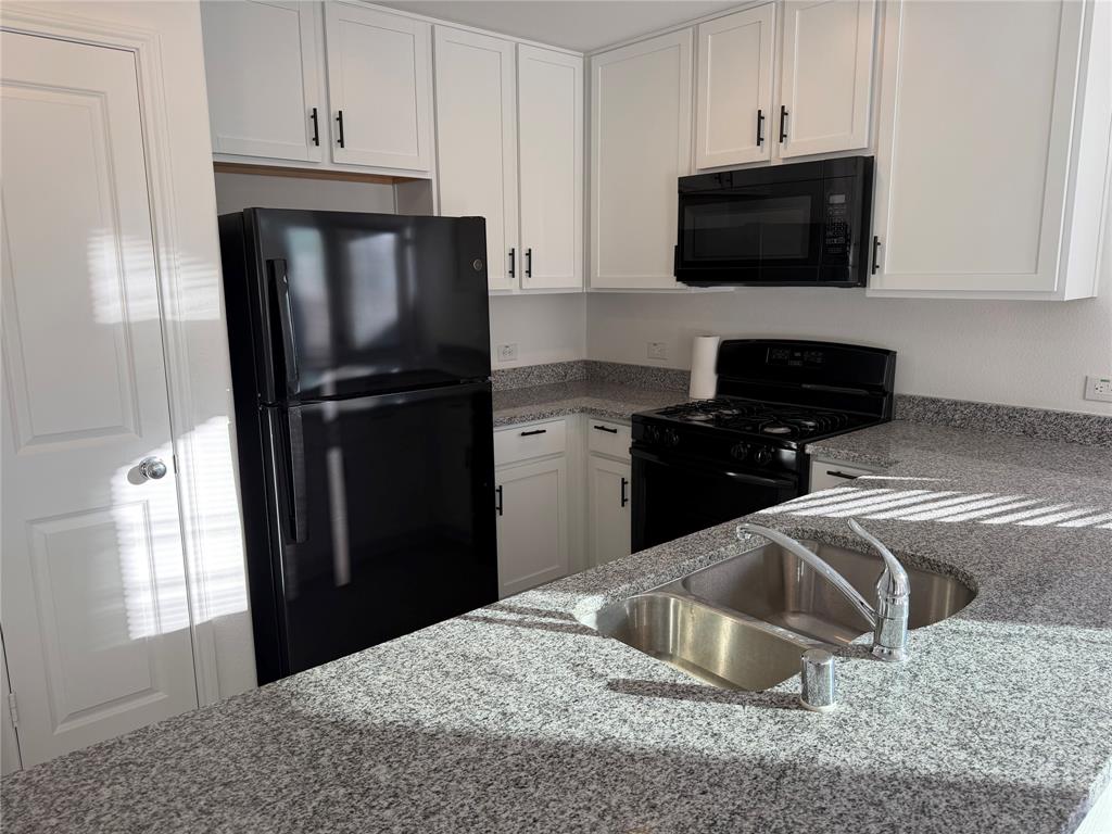 9012 Red Fox Trail McKinney, TX 75071 - Photo 1 of 35 a kitchen with a refrigerator stove and microwave