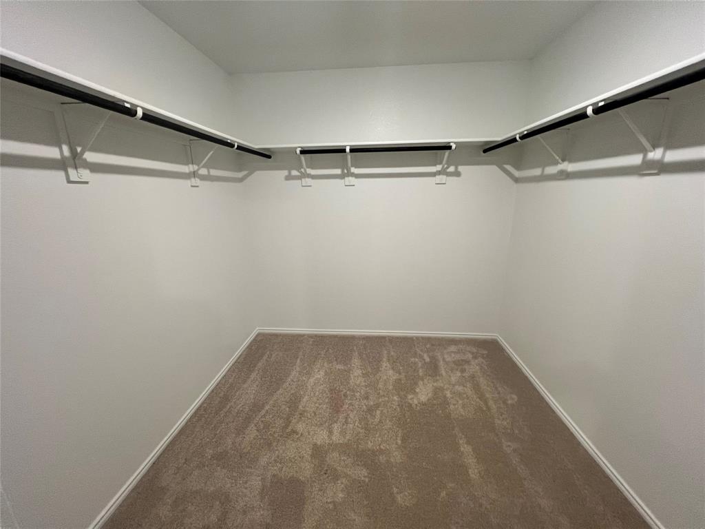 9012 Red Fox Trail McKinney, TX 75071 - Photo 13 of 35 a view of a room with racks on the wall