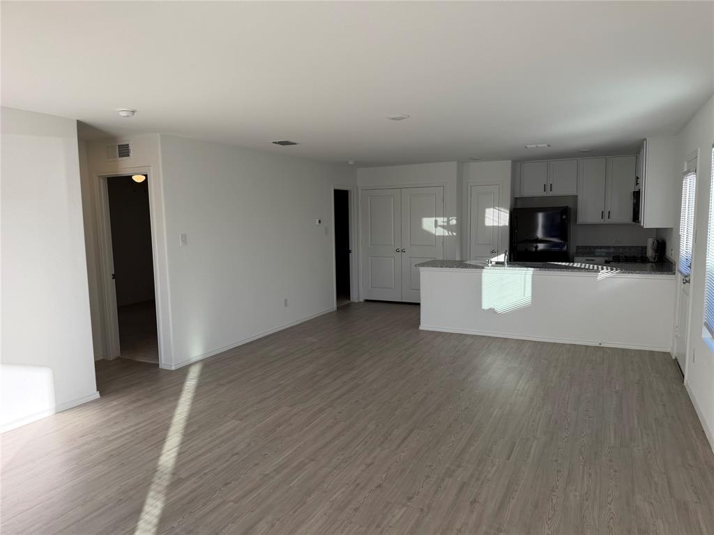 9012 Red Fox Trail McKinney, TX 75071 - Photo 23 of 35 a view of a kitchen with a sink and a refrigerator