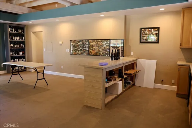 a dining room with furniture and a flat screen tv