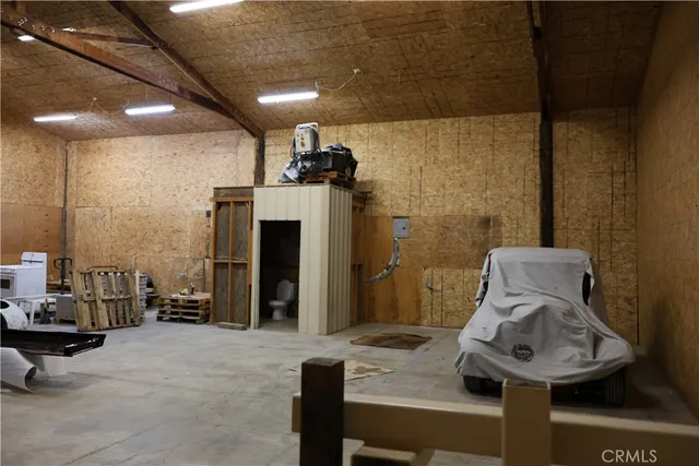 a black leather chair under an umbrella