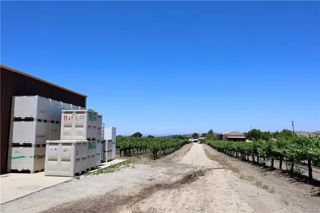 a view of a house with a snow in the road