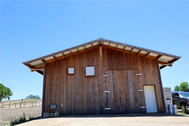 a view of a house with a yard and plants