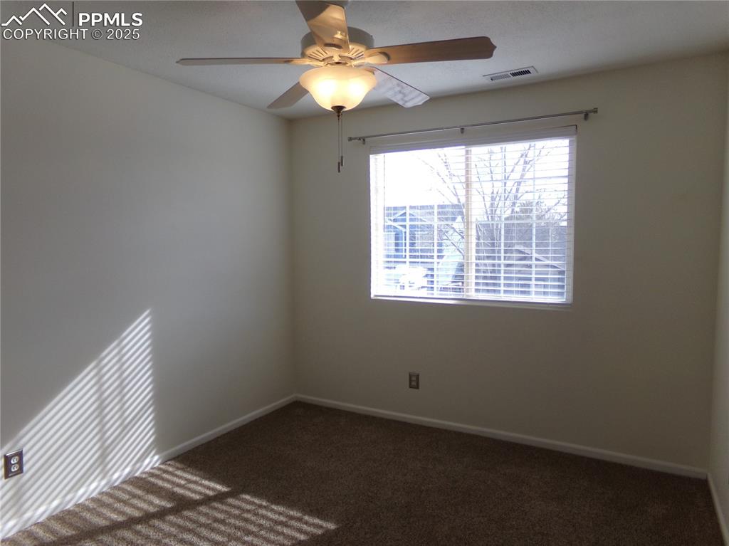895 Rancher Drive Fountain, CO 80817 - Photo 21 of 29 a view of an empty room with a window