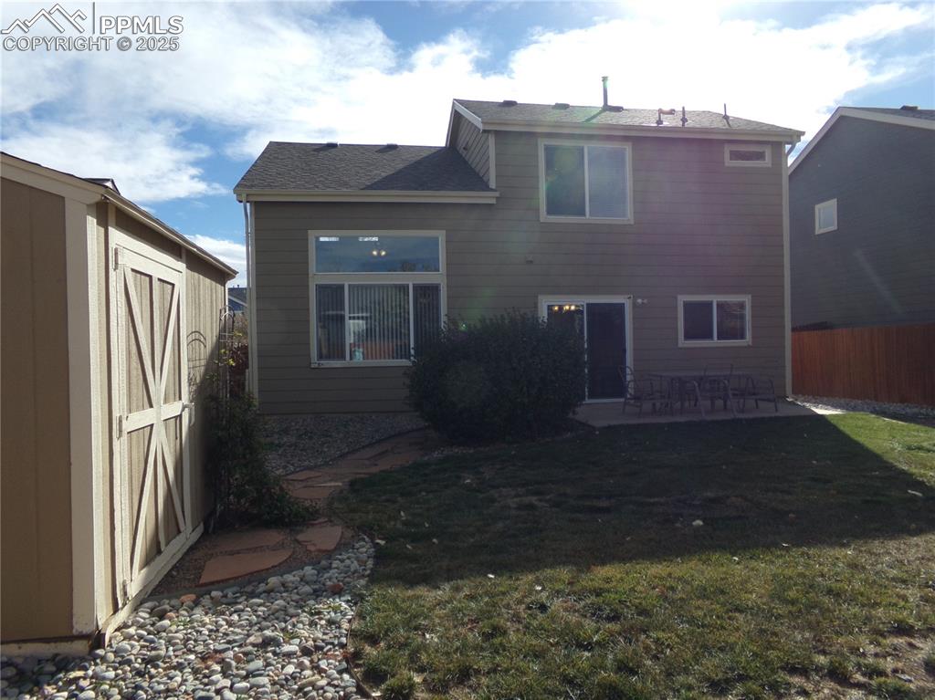 895 Rancher Drive Fountain, CO 80817 - Photo 27 of 29 a view of a house with a yard